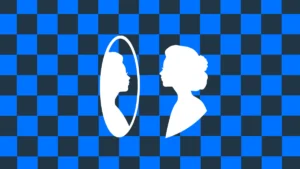 Osoba patrząca na swoje odbicie w lustrze jako symbol pracy nad pewnością siebie i wiarą w siebie