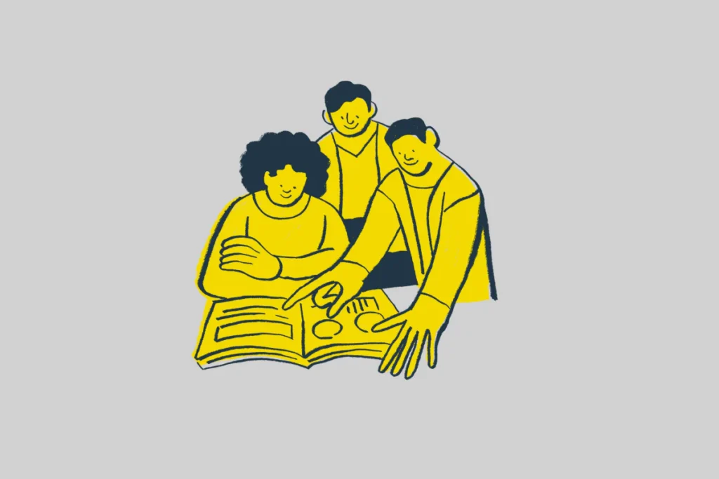 Trzy osoby analizujące plan rozwoju kariery i drogę do spełnienia zawodowego